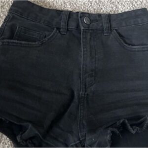 Slightly black ripped shorts